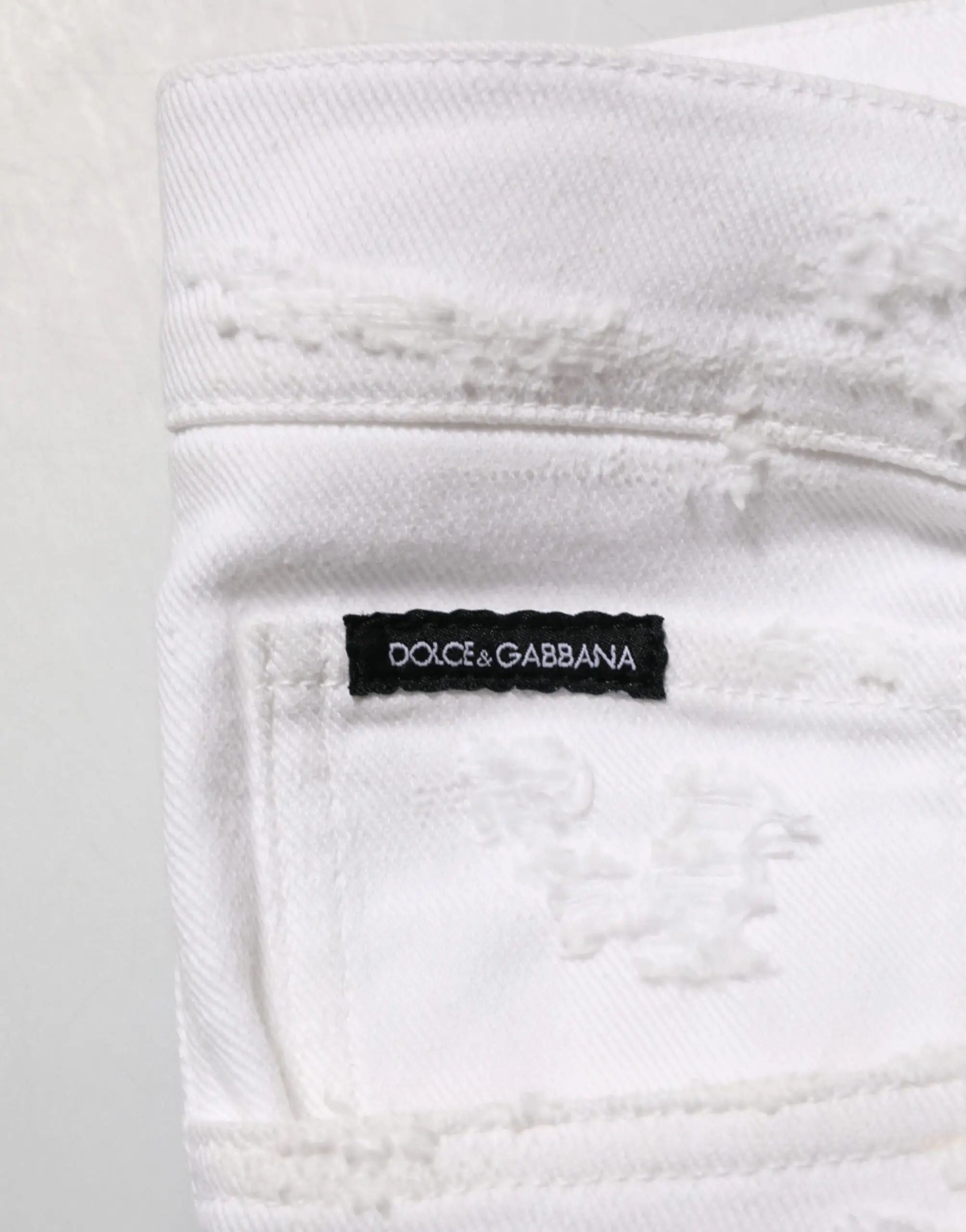 Белые рваные джинсы Dolce & Gabbana